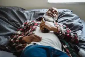 Man Sleeping with Beer Bottle