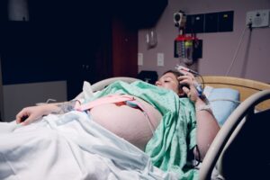 pregnant patient talking with a healthcare provider
