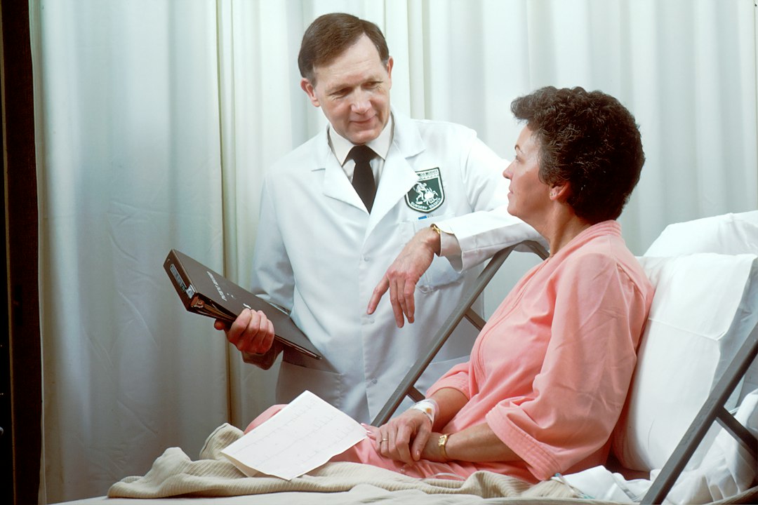 person speaking with a healthcare professional